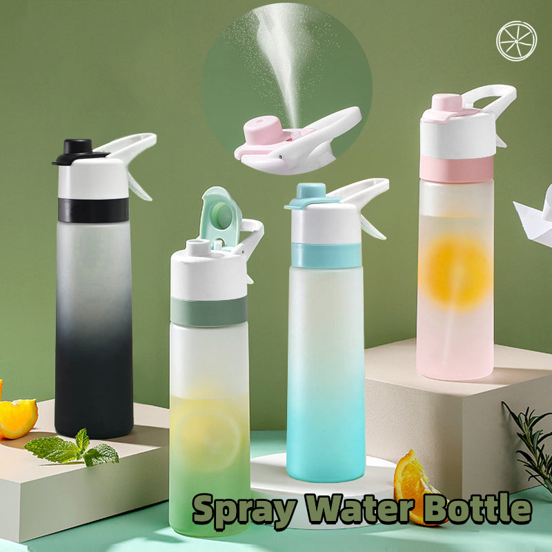 Spray water bottles with colorful designs on a green background